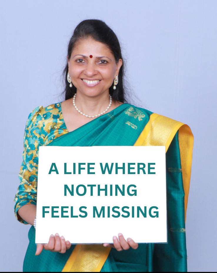 Shanthi Yogini holding a sign that says A Life Where Nothing Feels Missing